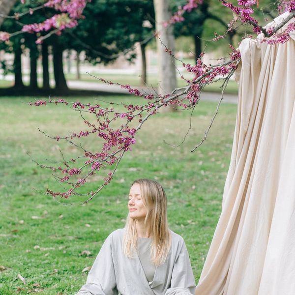 Serene woman meditating in a calm, focused environment.